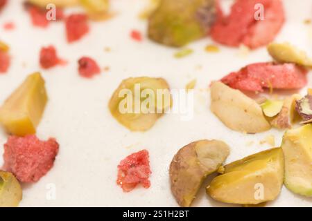 Traditional Easter dinner or brunch with ham, colored eggs, hot cross buns, cake and vegetables. Easter meal dishes with holday decorations. Stock Photo