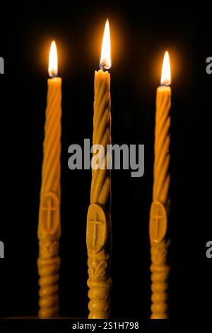 Bright Burning Candle in the Darkness. Remembrance and Memorial Day Symbol. Bright Candle Close-up Stock Photo