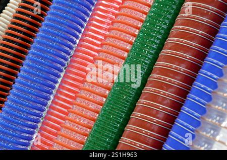 Group of multi-colored corrugated plastic hoses, abstract colorful background Stock Photo