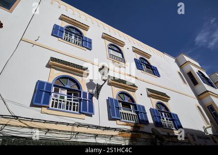 white painted colonial architecture with blue painted shutters medina old city unesco world heritage site essaouira, morocco Stock Photo