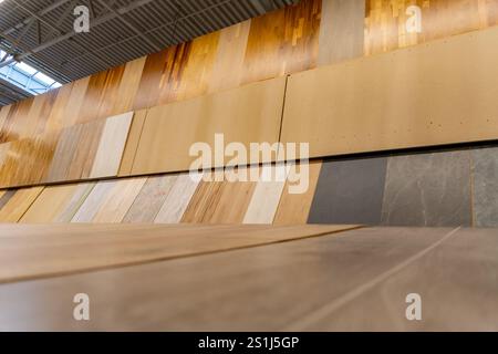 Variety of wooden flooring with different textures and colors in construction supermarket. This image capture an expansive display of floor samples, h Stock Photo