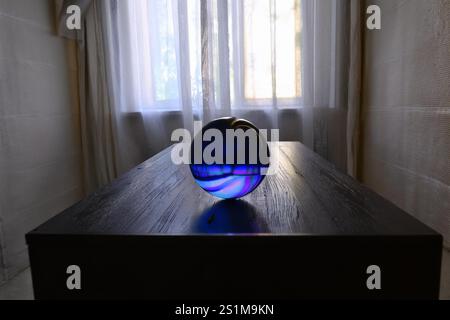 ORB: A mysterious highly intelligent lifeform exist within a spherical ball in a residential home with the ability to sense its occupants emotions. Stock Photo