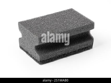 Black painting sponge used for washing dishes and art projects. Isolated on white. Stock Photo