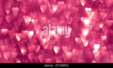 Blurred heart shapes creating romantic and dreamy pink abstract bokeh background Stock Photo