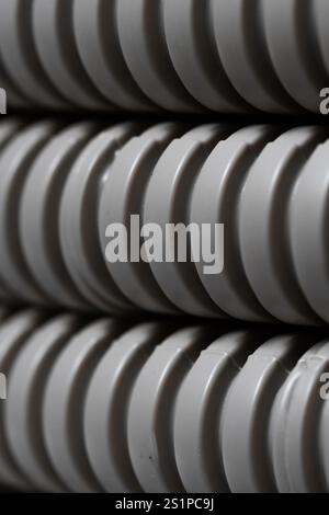 Closeup of grey, corrugated, plastic pipes Stock Photo