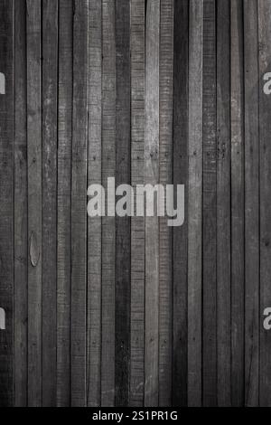 Front view of an old, aged and rustic wooden wall in black and white. Abstract full frame textured background, copy space. Stock Photo