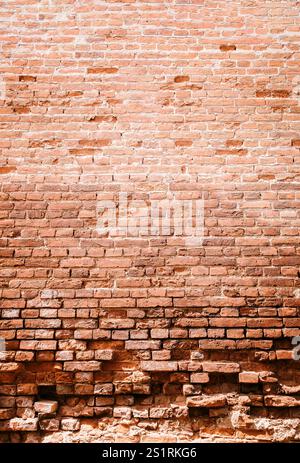 rustic a red brick wall texture, a timeless design element. The rough surface and warm hue .  used indoors or outdoors, the classic appeal of red bric Stock Photo