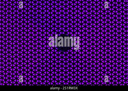 RGB Light Speaker Protective Cover Texture on Purple Background Stock Photo