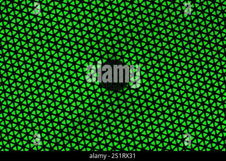 RGB Light Speaker Protective Cover Texture on Green Background Stock Photo