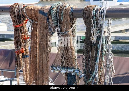 Fishing Net Railing A fishing net hanging on railing Stock Photo - Alamy