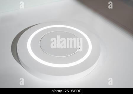 Wireless charging station on the table Stock Photo