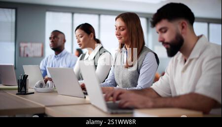 Diverse College Students Group In Classroom With Laptop Computers Stock Photo