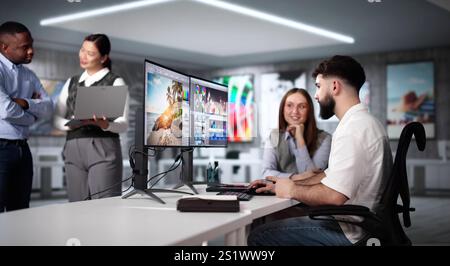 Graphic Designer Artist Team Working On Multiple Computer Screens Stock Photo