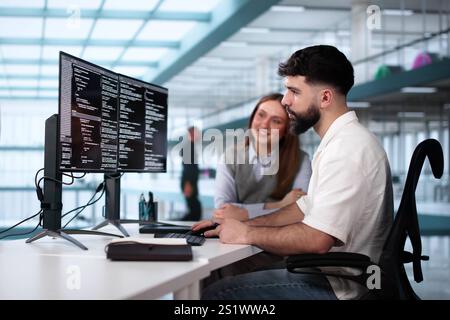 Software Engineer Developer Using Desktop Computer. Coding On PC Stock Photo