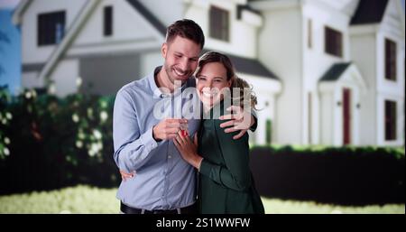 Portrait Of Happy Young Family Standing In Front Of Their House Stock Photo