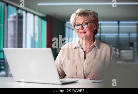 Watching Online Video Conference Meeting In Office Stock Photo