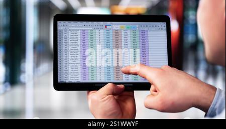 Financial Analyst Man Using Hybrid Medical Software On Laptop To Analyze Data For Accounting Business Stock Photo