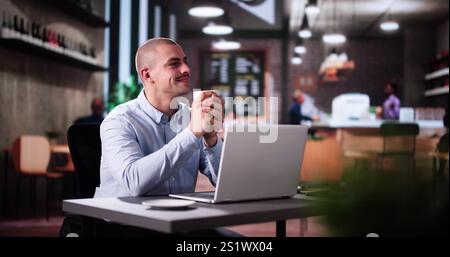 Analyst Businessman Thinking In Coffee Shop While Using Corporate Laptop Stock Photo