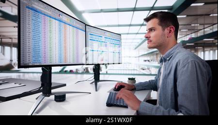 Data Analyst Man Using Spreadsheet On Computer Stock Photo