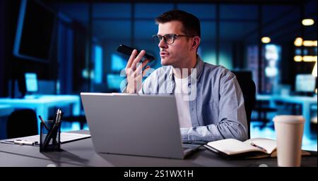 Business Man Talking On Phone Near Computer Stock Photo