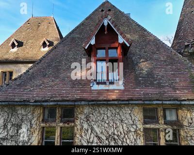 A broken pane of glass on a window of an old house following a theft or a storm Stock Photo