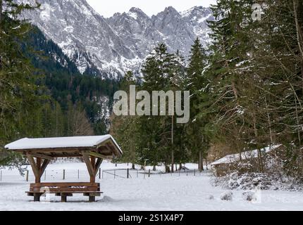 Wooden hut in the alps with mountains in the background Panorama Stock ...