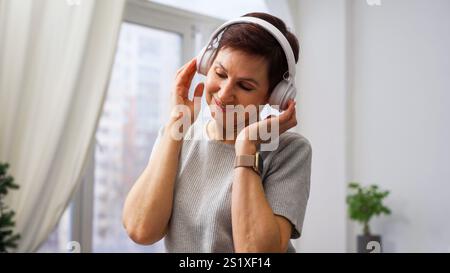Woman enjoying music in headphones Stock Photo
