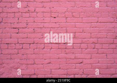 Background from a wall made of pink painted bricks Stock Photo