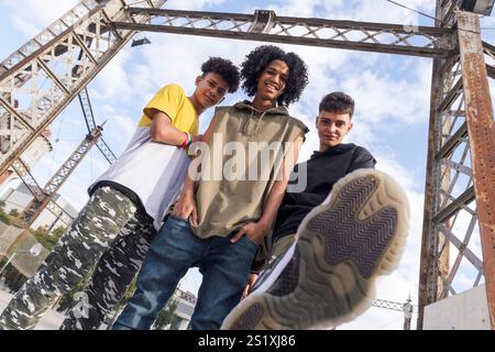 three teenagers looking at camera challenging Stock Photo