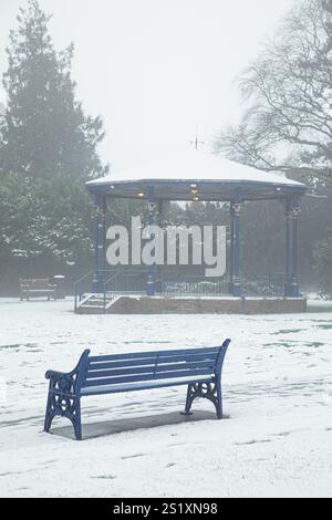 The band stand in the snow at Garth Park, Bicester. Stock Photo