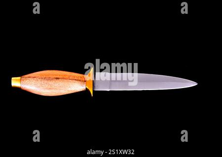 Edged weapon dagger isolated over a black background Stock Photo