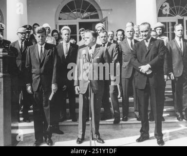 Dsecription NASA Administrator James E. Webb (center) cites the space achievements of the Project Mercury Astronauts who received the 1963 Collier Trophy Award in a ceremony held at the White House on October 10, 1963. President John F. Kennedy (left) and Vice President Lyndon Johnson accompanied Webb at the ceremony. Five of the Mercury Seven astronauts are visible in the row behind James Webb. They are (starting from JFK's left): Alan Shepard, Donald &quot;Deke&quot; Slayton, John Glenn, Virgil &quot;Gus&quot; Grissom, and Scott Carpenter. Stock Photo