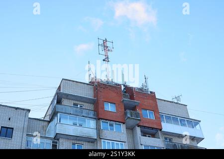Telecommunication Equipment Installed on the Rooftop of an Apartment Building in the City Stock Photo