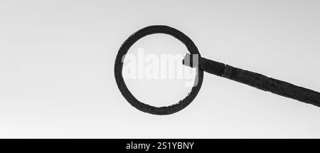 Circular frame made of iron from an anchor with monochrome grey background. Black and white frame within a frame for banner presentations. Stock Photo
