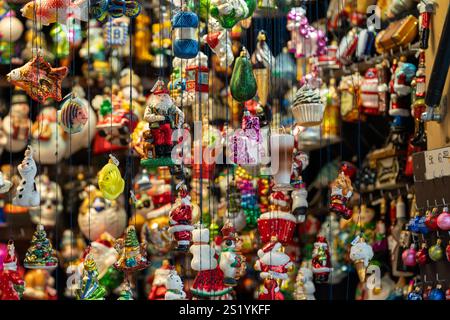 Various glass Christmas ball hand painted ornaments hanging on display at a Munich Christmas market Stock Photo