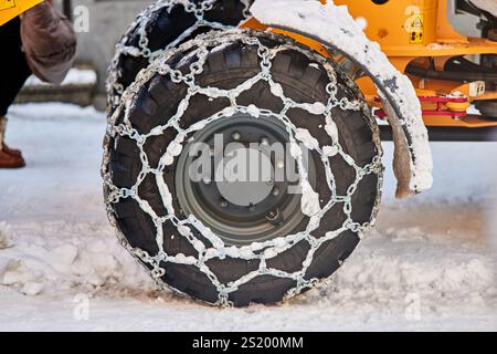 Winter scenes at Chamonix-Mont-Blanc ski resort in the French snow chains on tyres Stock Photo