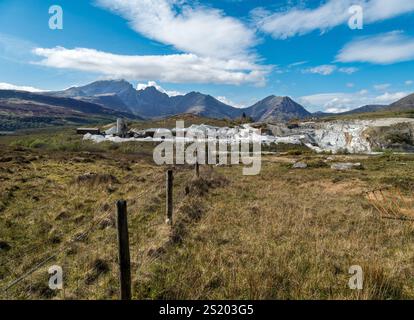 Torrin white marble quarry workings with Cuillin mountains beyond, Isle of Skye, Scotland, UK Stock Photo