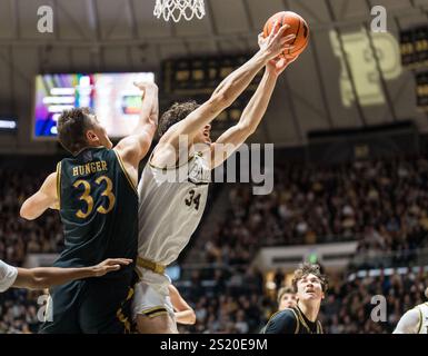 West Lafayette, Indiana, USA. 5th Jan, 2025. Purdue Boilermakers Forward RALEIGH BURGESS (34) grabs a rebound over LUKE HUNGER (33) of Northwestern during the NCAA menÃs basketball game between the Northwestern Wildcats and the Purdue Boilermakers, Sunday January 4, 2025, at Mackey Arena in West Lafayette, Ind. (Credit Image: © David Wegiel/ZUMA Press Wire) EDITORIAL USAGE ONLY! Not for Commercial USAGE! Stock Photo