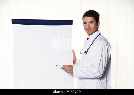 Successful doctor with flipchart at a presentation in Meeting Austria Stock Photo