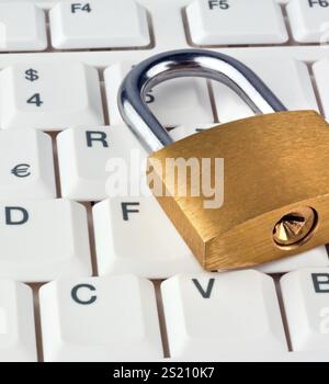 A padlock on a computer keyboard. Data security and protection, A padlock on a computer keyboard. Data security and protection. Austria Stock Photo