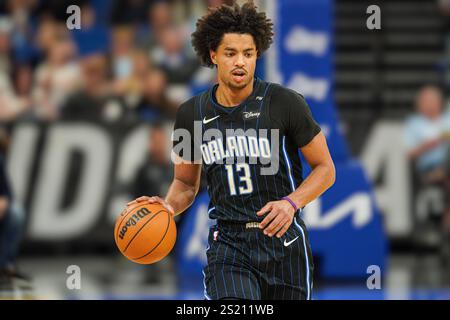 Orlando Magic guard Jett Howard (13) goes to the hoop as he is defended ...