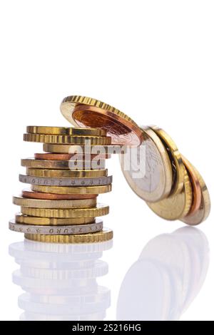 Euro cent coins falling into stacked on white background Stock Photo ...