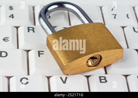 A padlock on a computer keyboard. Data security and protection, A padlock on a computer keyboard. Data security and protection. Austria Stock Photo