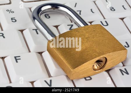 A padlock on a computer keyboard. Data security and protection, A padlock on a computer keyboard. Data security and protection. Austria Stock Photo