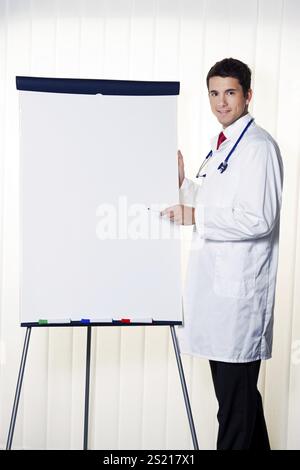 Successful doctor with flipchart at a presentation in Meeting Austria Stock Photo