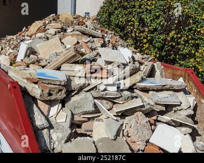 Construction waste from the demolition of a residential building in a container Austria Stock Photo