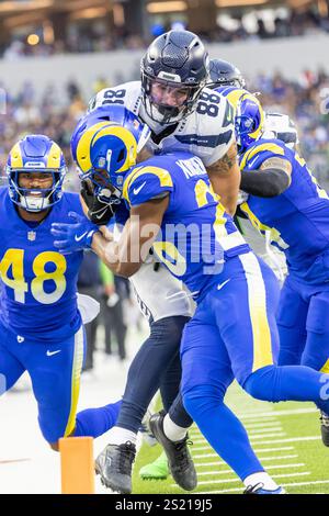 Los Angeles, California, USA. 5th Jan, 2025. Seattle Seahawks tight end AJ Barner #88 runs the ball fighting off pressure from the Los Angeles Rams during an NFL football game at SoFi Stadium, Sunday Jan. 5, 2025, in Inglewood, Calif. (Credit Image: © Ringo Chiu/ZUMA Press Wire) EDITORIAL USAGE ONLY! Not for Commercial USAGE! Credit: ZUMA Press, Inc./Alamy Live News Stock Photo