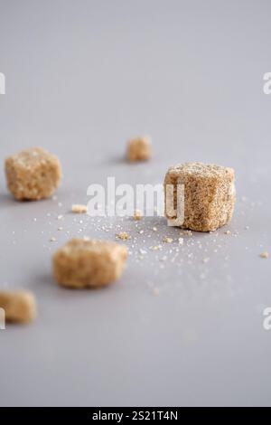 Brown sugar cubes on table Stock Photo