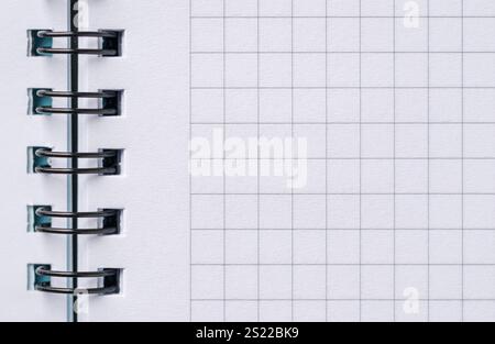 Top view of blank notebook page with black spiral and squares Stock Photo