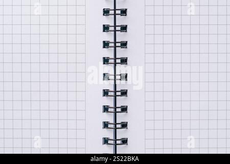 Top view of blank notebook page with black spiral and squares Stock Photo